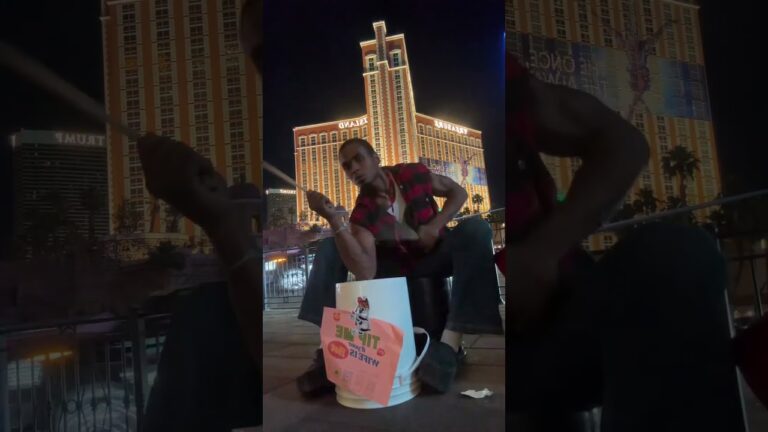 RED Hitting Bucket Drumming Street Performing busking on The las Vegas Strip